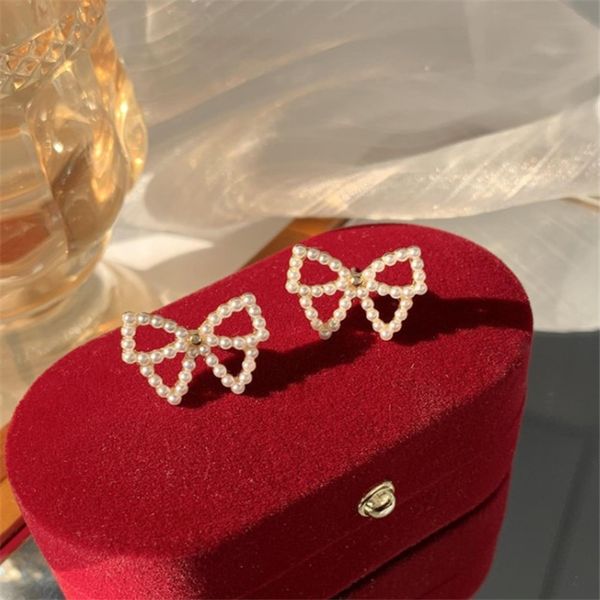 

bowknot pearl stud temperament korean personality simple fashion versatile earrings, Golden;silver