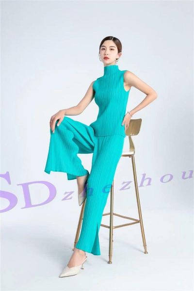 

women's two piece pants selling miyake style turtleneck sleeveless t-shirt in the fold hem slit solid two-piece outfit stock, White