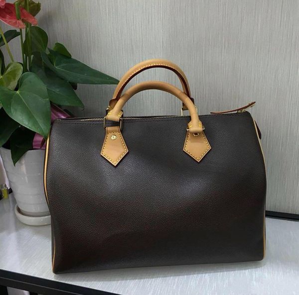 

luxurys designersspeedy classic hand bag natural barrel shaped cowhide leather trim textile lining gold hardware 2 handles women boston shou