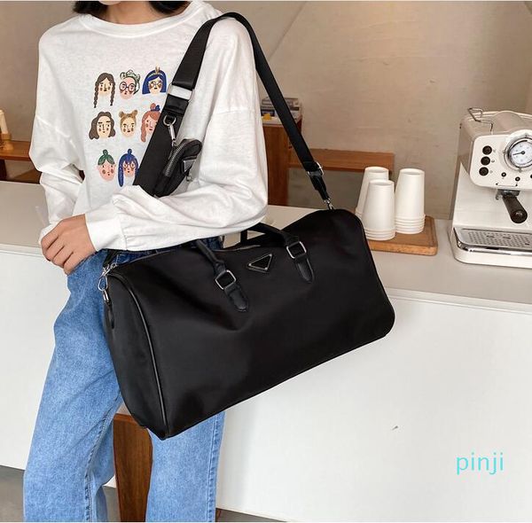 

wholesale p-ra luxury designer brand duffel bag 2021 latest fashion classic men women high capacity outdoor sports nylon travel boarding