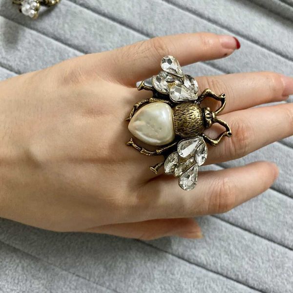 

2022 european and american letter open ring retro brass material diamond-studded pearl double-winged bee accessories female high-quality, Silver