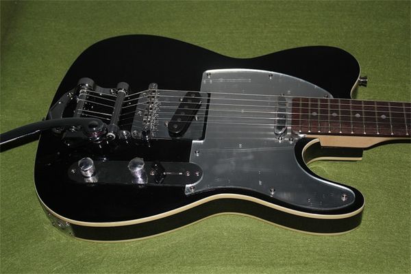 

satin black tl guitar with golden hardware
