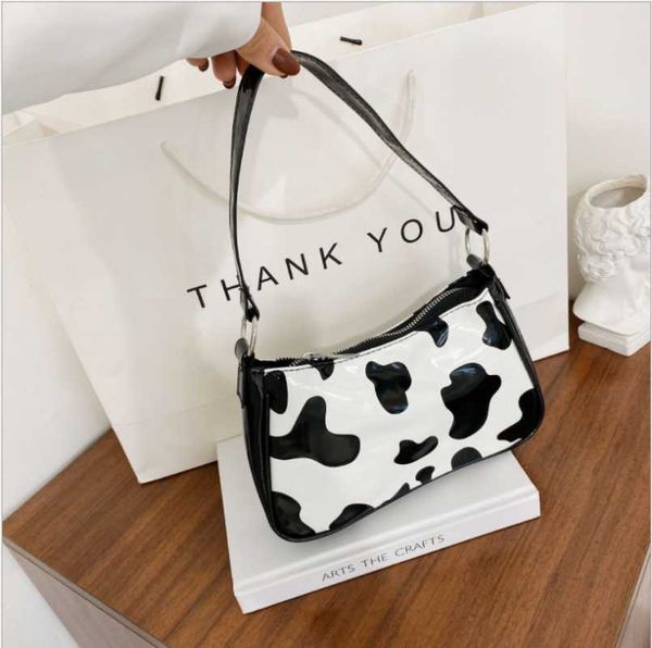 

evening bags cow milk print pattern baguette for women 2021 bright pu leather small shoulder bag female designer underarm bolsos