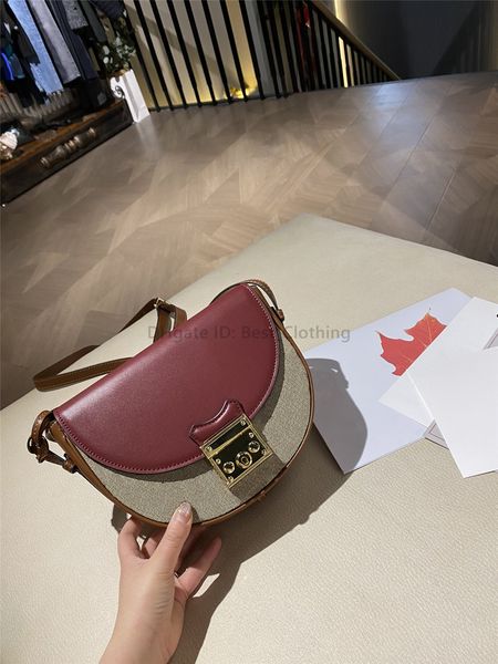 

2021 cross body two-tone bag baking g gpaint small round chain single shoulder slanting saddle lock solid color versatile half moon women&#0