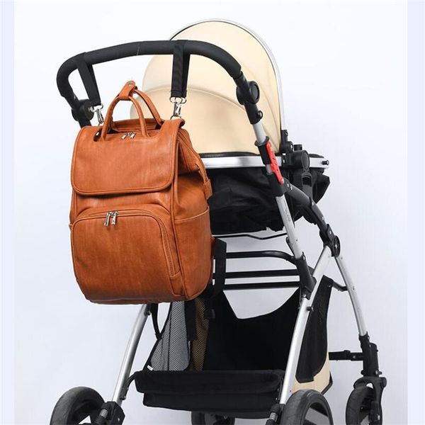 

diaper bags pu mode mummie moederschap luiertas grote capaciteit reizen draagbare luier melkfles kinderwagen rugzak vrouwen tas