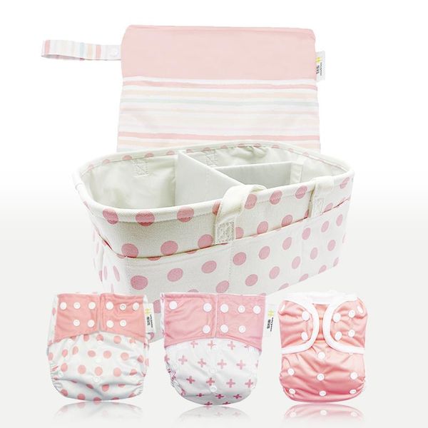

cloth diapers washable three pink pieces green with nappy bag and diaper caddy