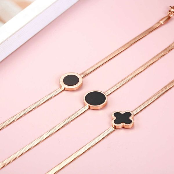 

korean titanium steel round roman digital female black rubber drop clover bracelet, extension chain adjustable