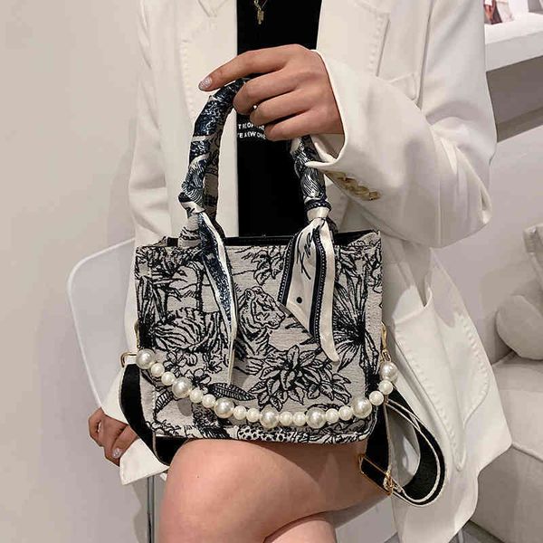 

2022 latest luggage factory wholesale april high capacity women's bag pearl literature and art national style portable single shoulder