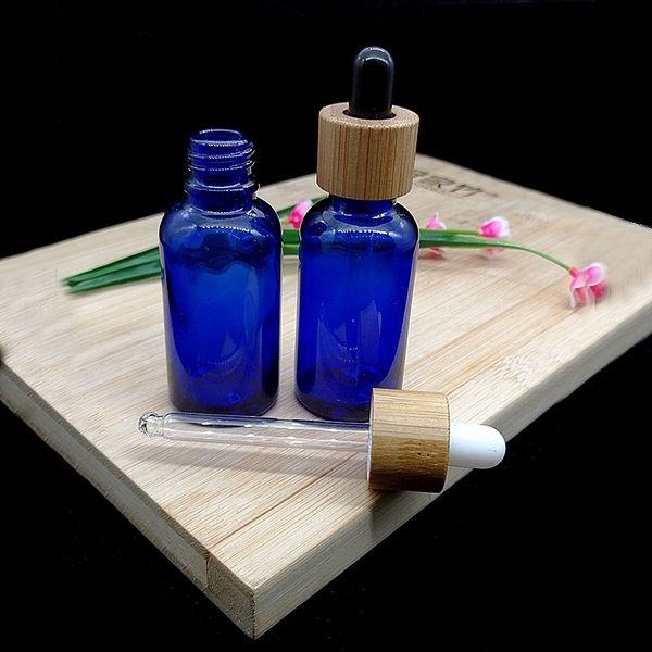 

factory blue glass dropper, empty bottle, wood 30ml grain, bamboo essence, essence oil, cosmetic packaging container.