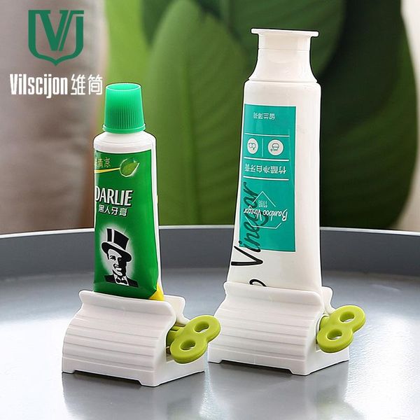

toothbrush holders the lazy man squeezer bathroom simple rotary toothpaste drop
