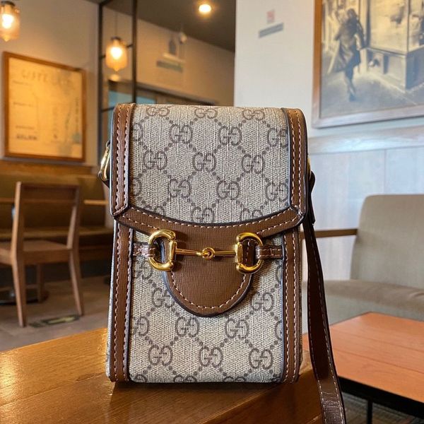 

a lovely bag with a gift box and a classic flower horse clasp ysj