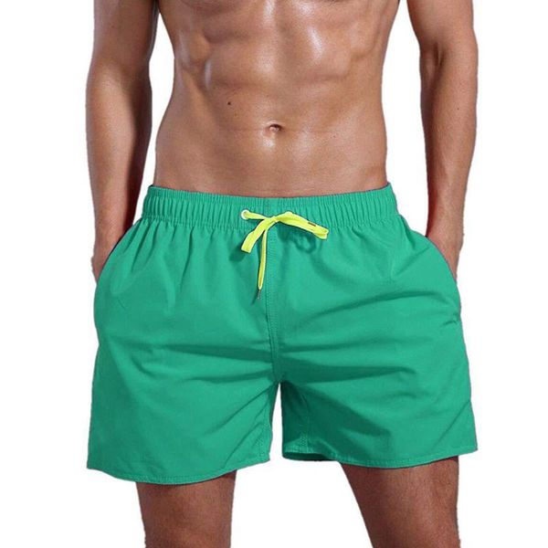 

men summer mid rise drawstring trunks solid color quick dry cotton shorts mesh lining casual beach pants with zipper pocket men's, White;black