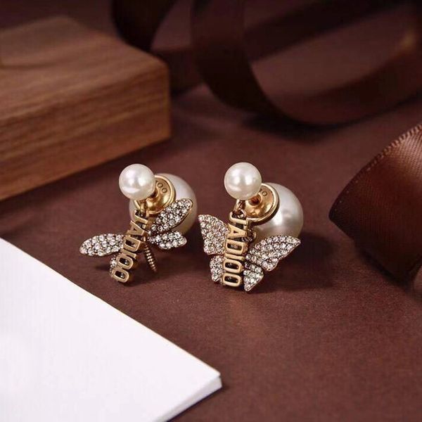 

70% off outlet online family asymmetric letter pearl female net red butterfly high version earrings, Silver