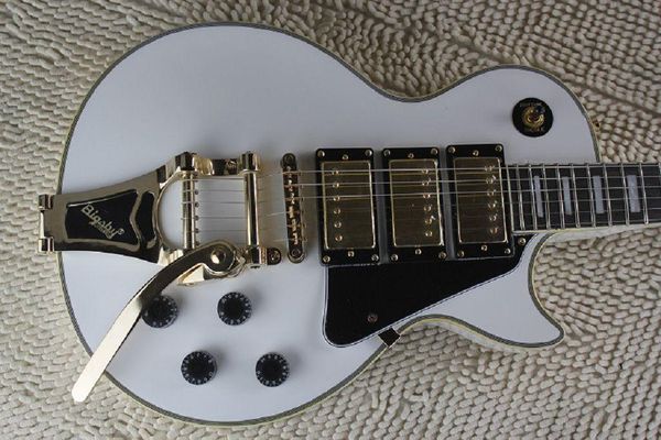 

custom golden hardware 3 pickup with white electric guitar