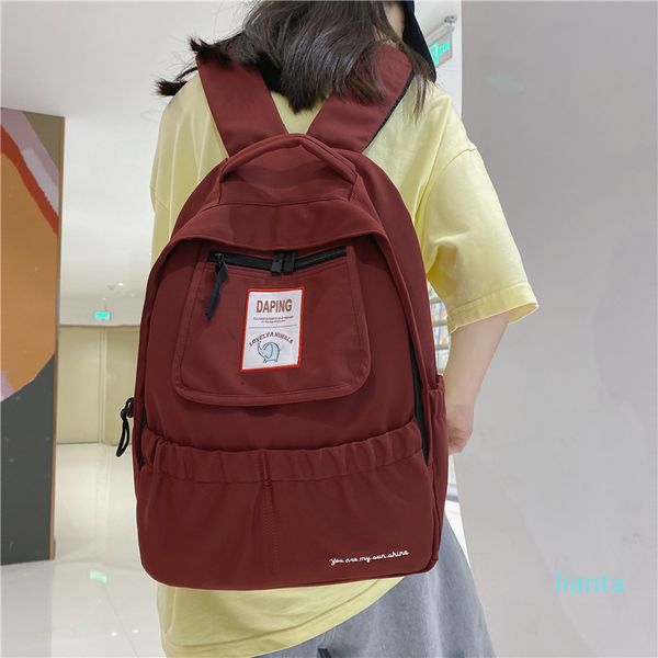 

2021 student shoulder bag korean version new junior school backpack female wind color travel solid ins high rbxqg