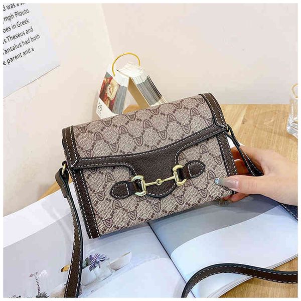 

2022 latest luggage factory wholesale old flower mobile phone women's bag summer new version one shoulder messenger bag trend contrast, Black;red