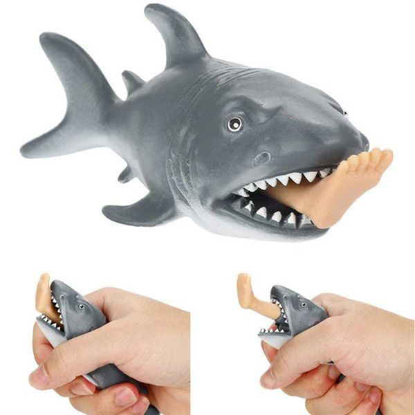 

3pieces/lot1pcs creative spoof of the leg-biting shark toy. when squeezed one leg pops out of the sharks mouth. funny prank trick