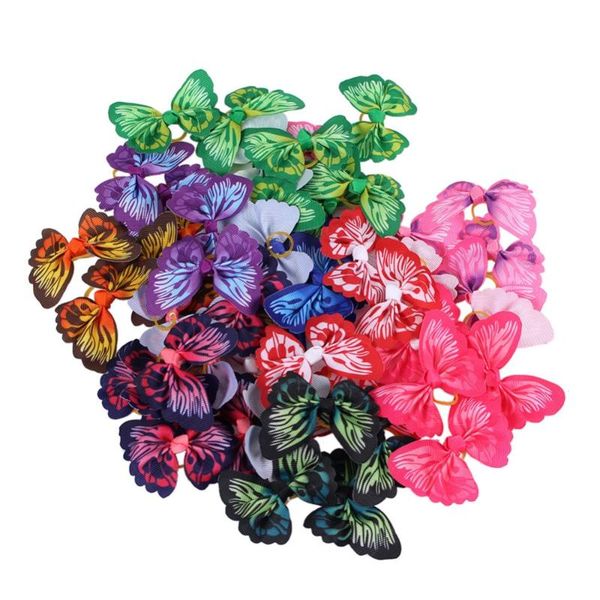 

dog apparel 50pcs wholesale butterflies dogs bows hair accessories with rubber band for long pet grooming products honden strikjes