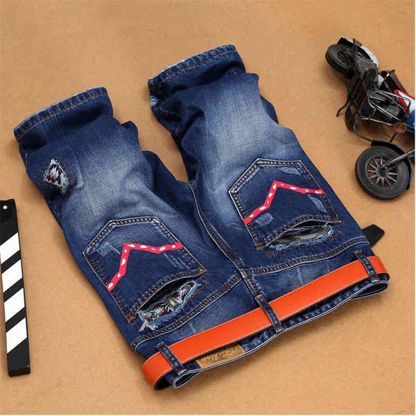 

fashion jeans a style of with holes in the street, Blue