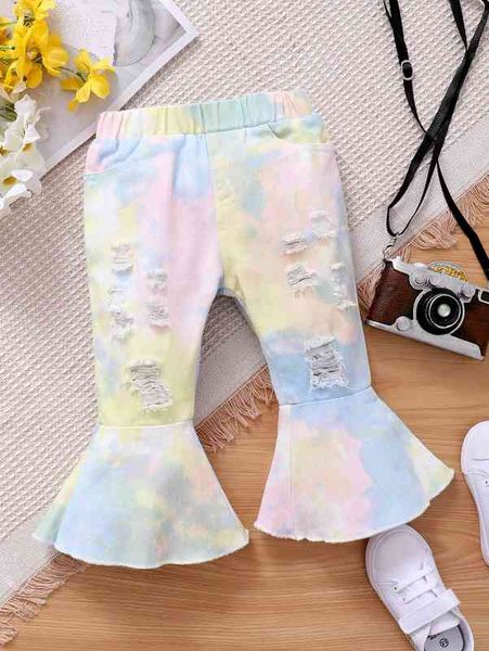 Zerrissene Baby-Jeans mit ausgestelltem Bein und Batikmuster SIE