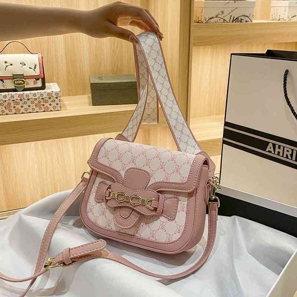 

2022 latest handbag factory store on feeling women's style semi-circular single shoulder messenger rank buckle old flower