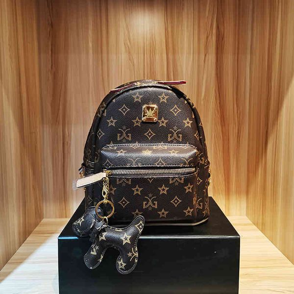 

blue valley flower print rivet backpack