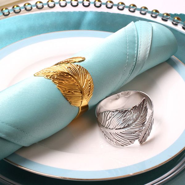 

silver gold leaf napkin rings table