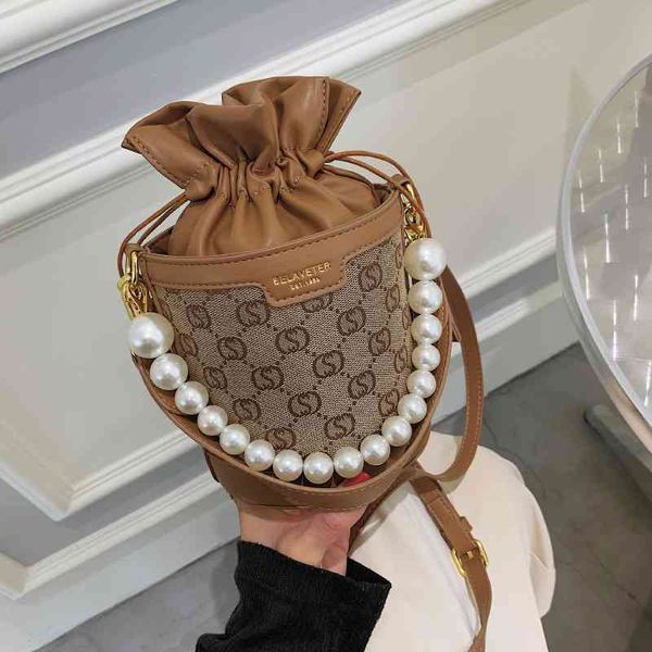 

small bag female new fashion high sense style messenger versatile pearl portable bucket purses