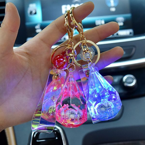 

2021 fashion keychain korean acrylic water drop chain with light, magic leather rope key chain, oil flowing sand pendant, Slivery;golden