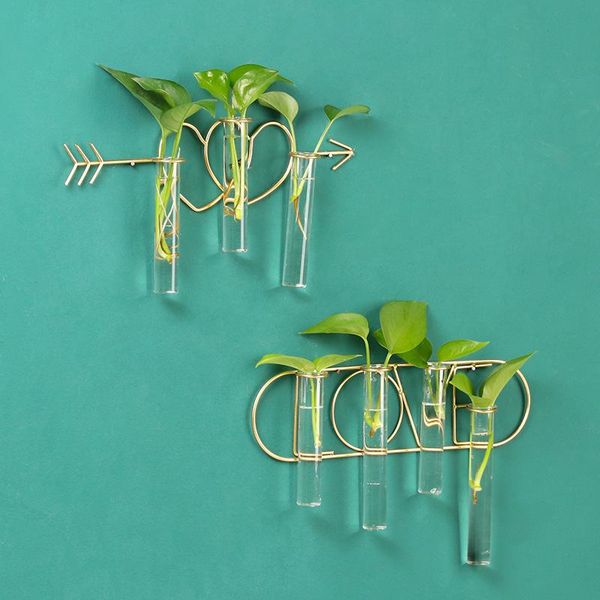 

simple modern personality, one arrow through the heart, iron art hydroponic wall decoration, living room, bedroom, shop decorative flowers &