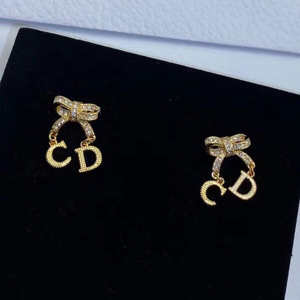 

d di jia xiao xiang feng cd letter bow 925 silver needle earrings