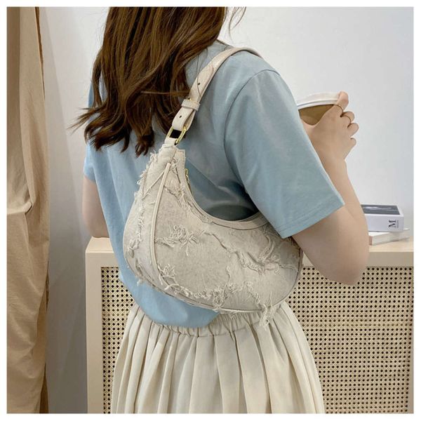 

2021 trend armpit bag simple hand carrying single shoulder fashion easy to build messenger multiple back french canvas women's