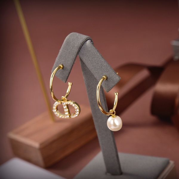 

2021 luxury designer jewelry new asymmetric pearl earrings in 2021, Silver