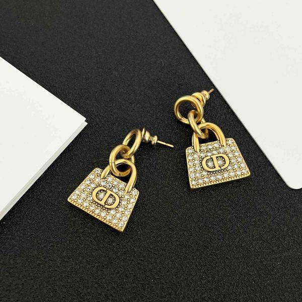 

design jewelry family niche bag fashion temperament advanced sense atmosphere golden personalized silver needle earrings