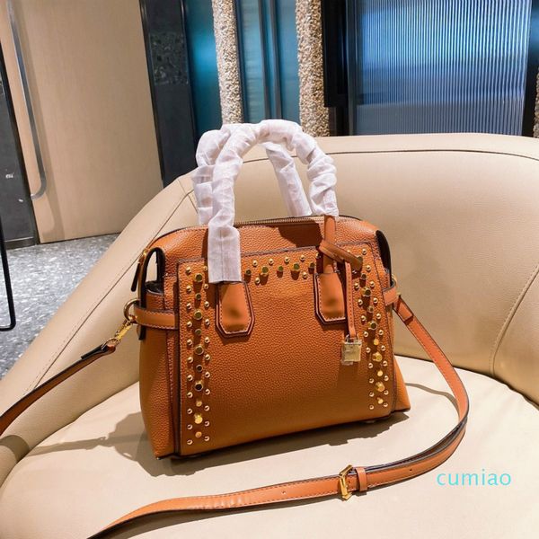 

2021 leather rivet handbag mature women's fashion shoulder bag beautiful pure color soft leather alloy logo bag
