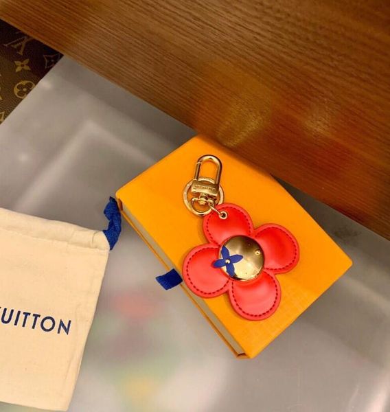 

sweet fashion four-leaf clover key wallets luxury designer letter printing female keychain bag pendant famous brand sunflower male car keych, Red;blue