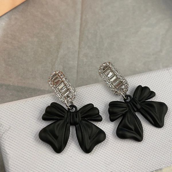 

charm miss miao dark black bow miu earrings female korean minority design light luxury ear style fashion versatile, Golden