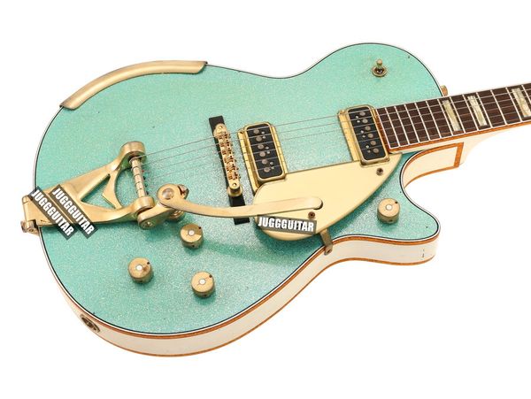

custom shop masterbuilt 1955 duo jet surf metallic green electric guitar white back sides headstock, gold sparkle binding, bigs tremolo brid