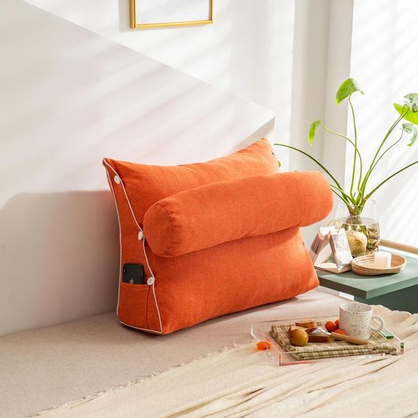 

single triangle pillow and cylindrical sleeping or lumbar with adjustable cushions on the sofa bedside
