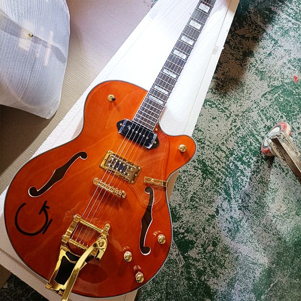 

6 string orange semi-hollow electric guitar with rosewood fretboard,acrylic pickguard
