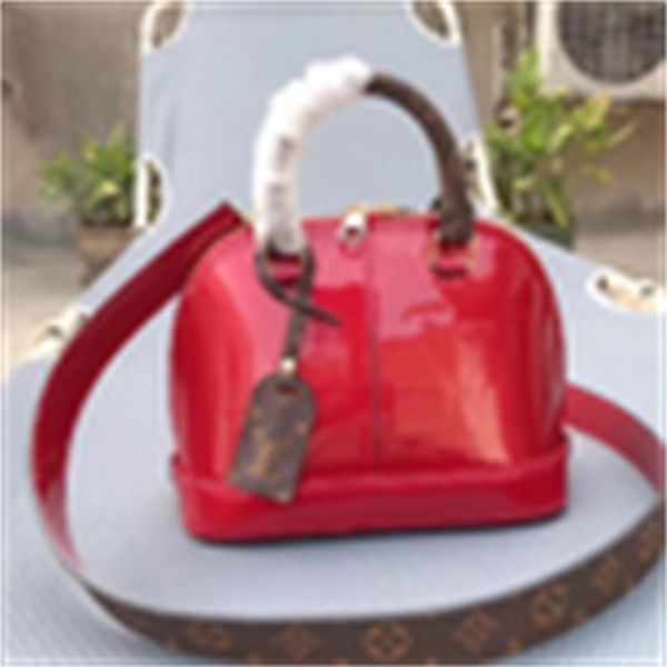 

bag iconic bags designer shell bag handbags luxury handles shoulder m54785 totes cross body tote clutches evening miroir