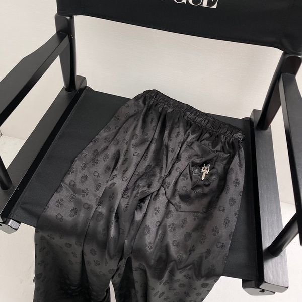 

crosin the new ch men's and women's pants in sanskrit, White;black