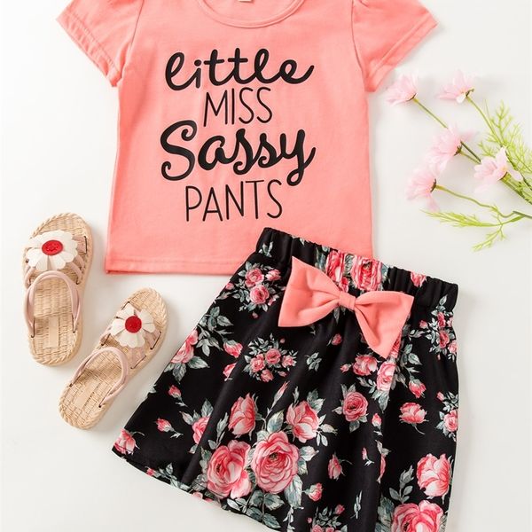 

little girl's lettered t-shirt and printed bow skirt she, White