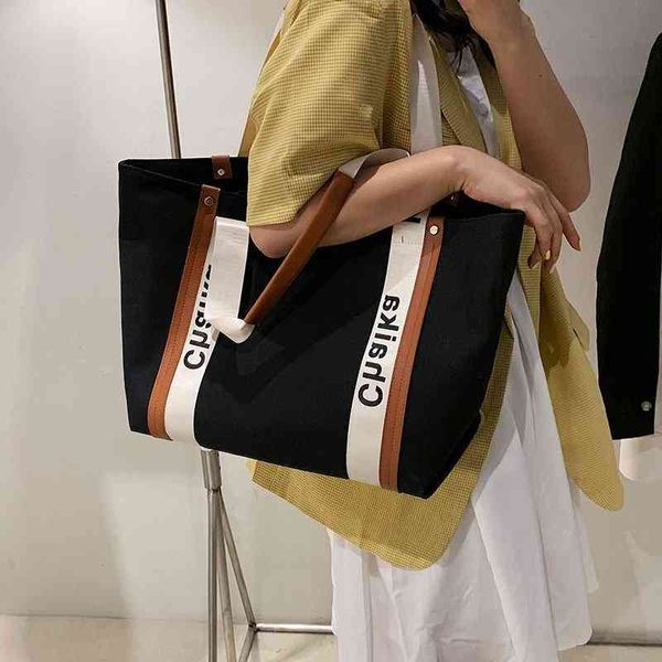 

outlet handbags 2022 new version lazy wind large capacity canvas college student class commuting bag shoulder sale_18f1