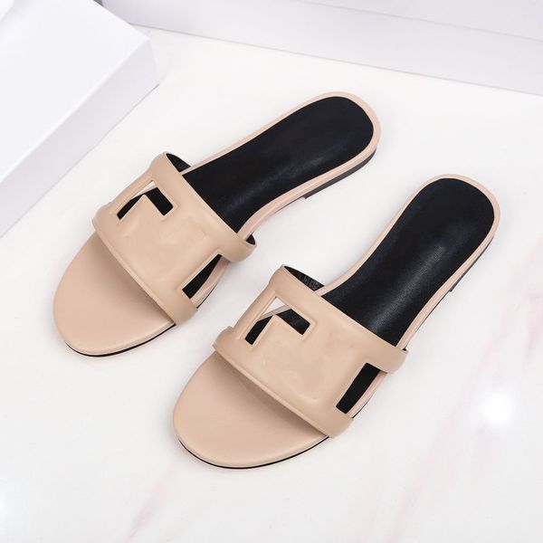 Sandali piatti estivi in pelle per donna scarpe di design scavate di colore puro comode pantofole da spiaggia sandalo da esterno pantofola moda donna 2022