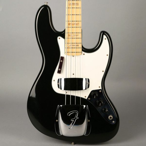 

jazz bass - 1974 - black and manual electric guitar
