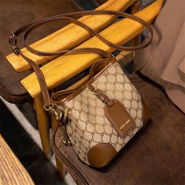 

purse handbag women's 2023 spring new canvas bucket bag versatile sling one shoulder bag foreign style messenger bag trend
