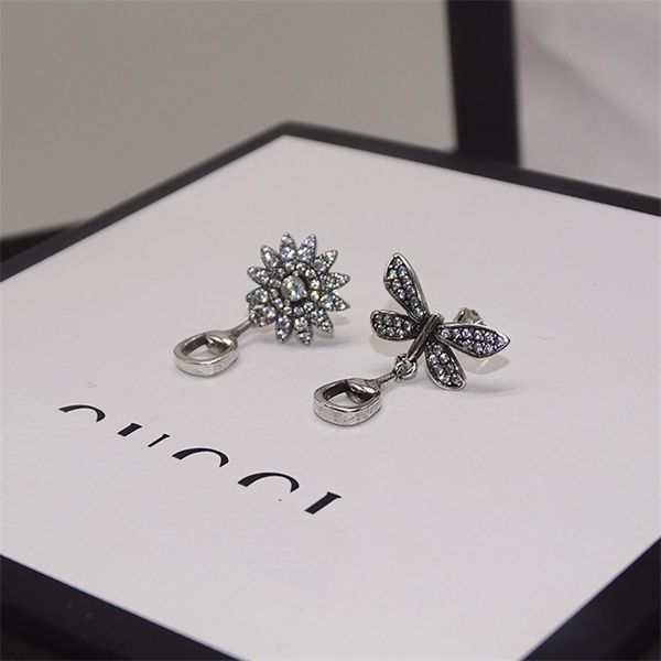 

jewelry online zhigujia 925 daisy inlaid with asymmetric and stone earrings temperament fashion trend, Golden