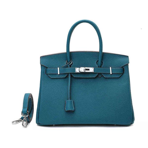 

2022 layer cow leather bag litchi pattern fashion sier buckle women's hand shoulder