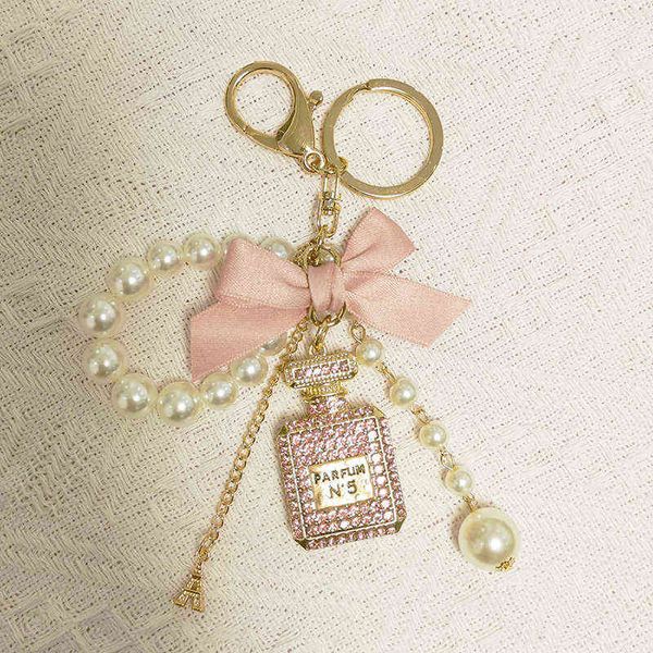 

pearl chain number 5 bottle keychain for woman luxury jewelry bow car keyring camellia pearl pendant keychains bag decoration aa220318, Silver